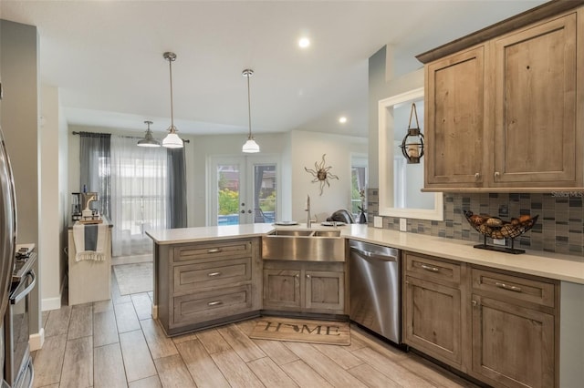 2113 Kirkland Lake Dr, Auburndale, FL 33823 - kitchen with stainless steel dishwasher, a peninsula, backsplash, recessed lighting, and a sink