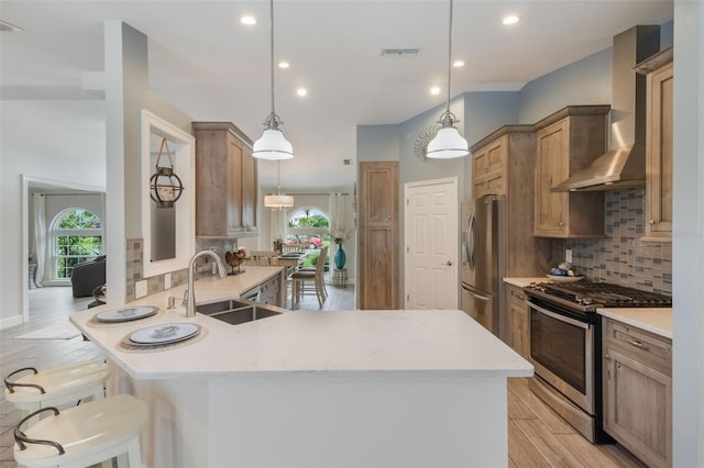 2113 Kirkland Lake Dr, Auburndale, FL 33823 - kitchen with stainless steel appliances, wall chimney exhaust hood, a sink, a peninsula, and decorative backsplash