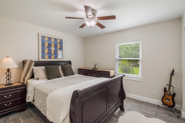 2113 Kirkland Lake Dr, Auburndale, FL 33823 - bedroom featuring baseboards, dark wood-style floors, and a ceiling fan