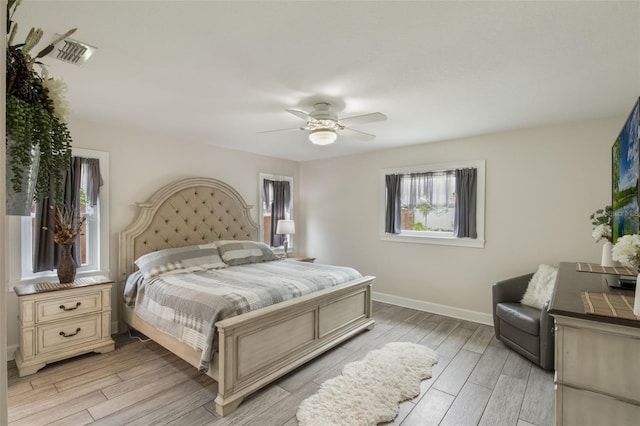 2113 Kirkland Lake Dr, Auburndale, FL 33823 - bedroom featuring light wood finished floors, baseboards, and ceiling fan