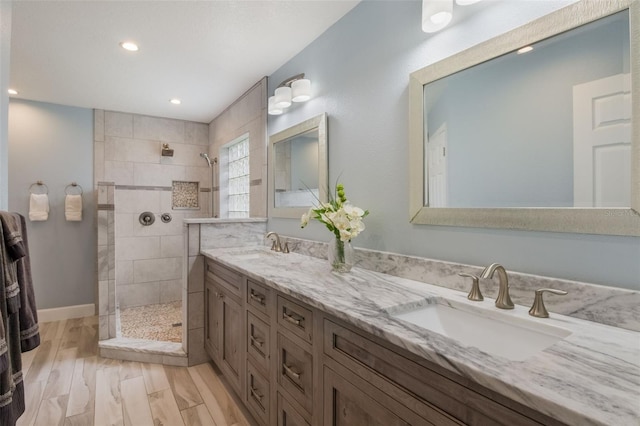 2113 Kirkland Lake Dr, Auburndale, FL 33823 - bathroom with a walk in shower, double vanity, recessed lighting, and wood finished floors