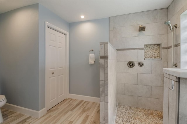 2113 Kirkland Lake Dr, Auburndale, FL 33823 - bathroom featuring a walk in shower, toilet, wood finished floors, a closet, and recessed lighting