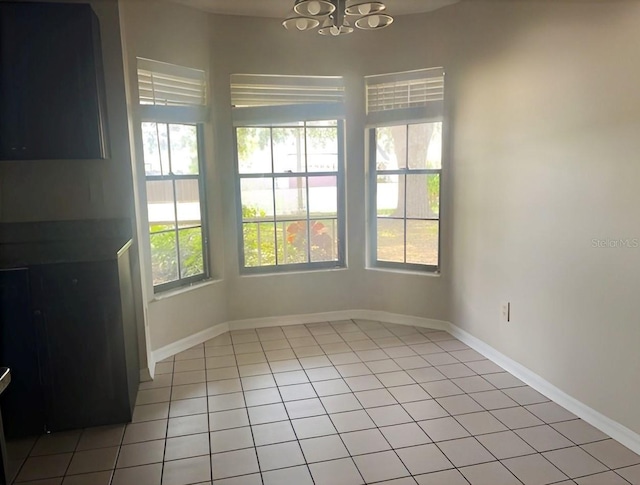 1606 Red Clover Ct, Orlando, FL 32825 - unfurnished dining area featuring a chandelier and light tile patterned floors