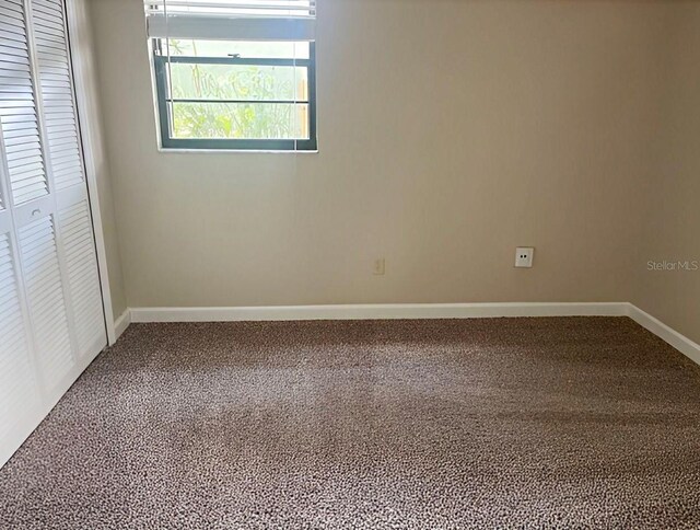 1606 Red Clover Ct, Orlando, FL 32825 - unfurnished bedroom featuring a closet and carpet flooring