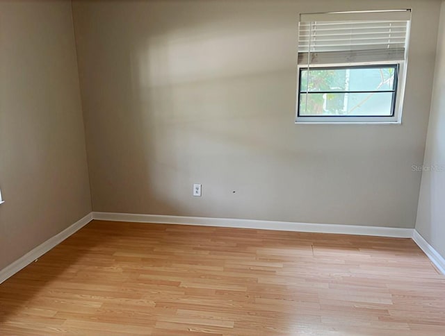 1606 Red Clover Ct, Orlando, FL 32825 - spare room featuring light wood-style flooring and baseboards