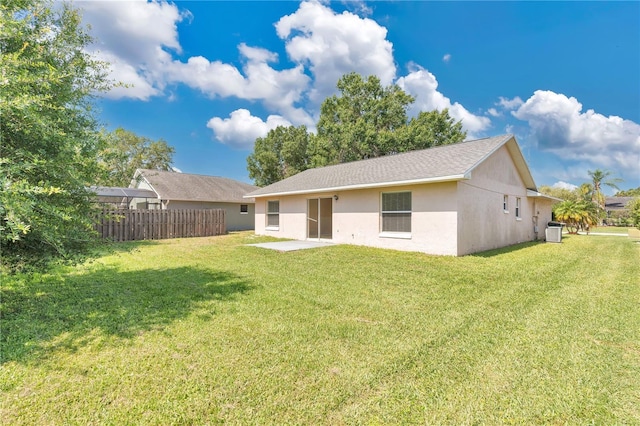 1614 Christa Ct, Saint Cloud, FL 34772 - rear view of property featuring central AC unit, stucco siding, and a patio