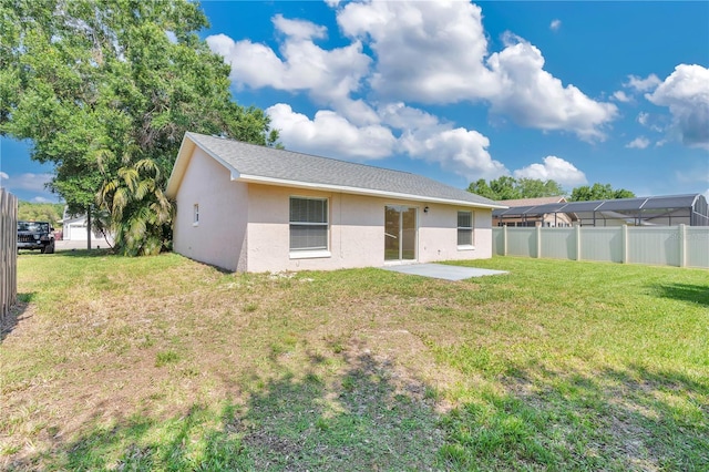 1614 Christa Ct, Saint Cloud, FL 34772 - back of house with stucco siding and a patio area