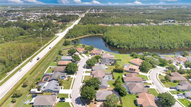 1614 Christa Ct, Saint Cloud, FL 34772 - view of property location with a nearby body of water, nearby suburban area, and a heavily wooded area