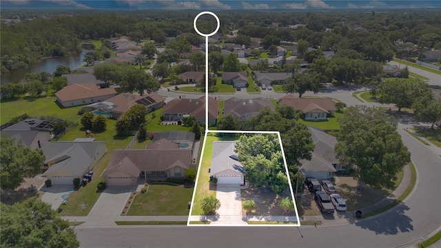 1614 Christa Ct, Saint Cloud, FL 34772 - aerial perspective of suburban area with a nearby body of water and property boundaries highlighted