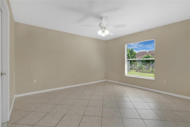 1614 Christa Ct, Saint Cloud, FL 34772 - empty room with a ceiling fan, light tile patterned floors, and baseboards