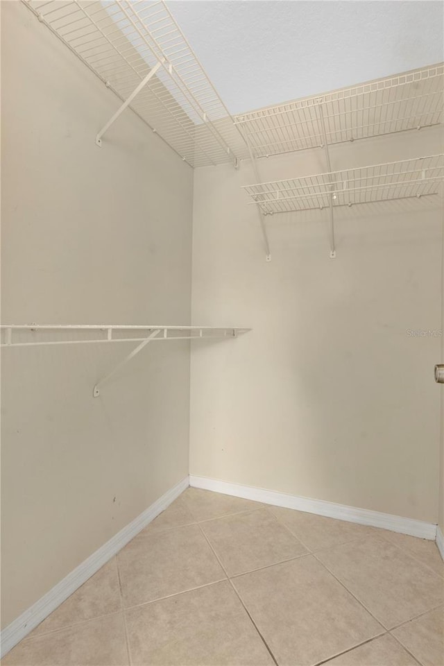 1614 Christa Ct, Saint Cloud, FL 34772 - spacious closet with light tile patterned flooring