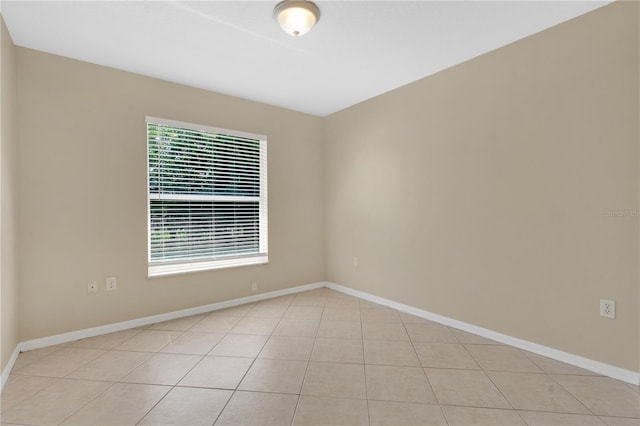 1614 Christa Ct, Saint Cloud, FL 34772 - empty room featuring light tile patterned floors and baseboards