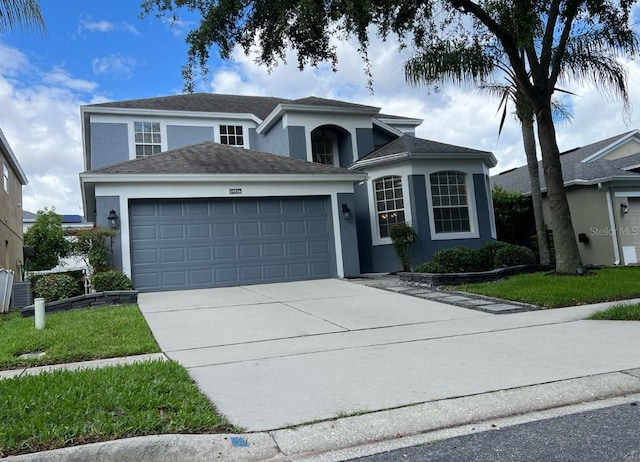 14936 Masthead Landing Cir, Winter Garden, FL 34787 - traditional-style home with stucco siding, a garage, and concrete driveway
