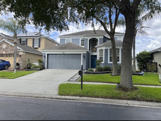 14936 Masthead Landing Cir, Winter Garden, FL 34787 - traditional-style home with a garage, stucco siding, a front yard, concrete driveway, and roof with shingles