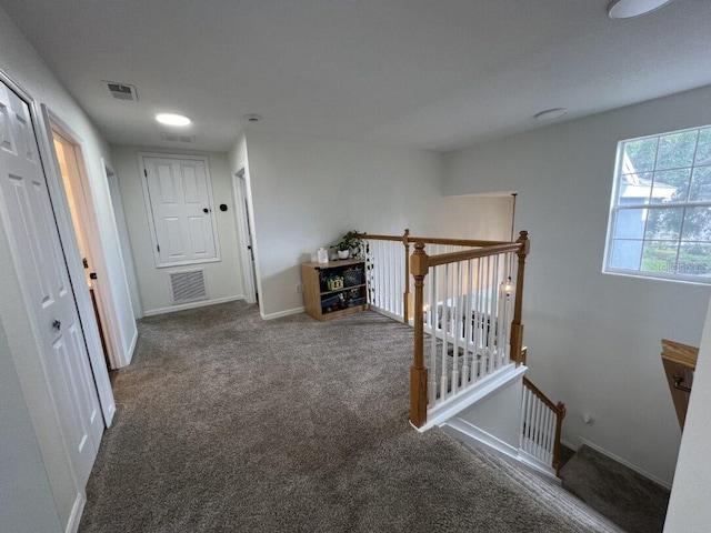 14936 Masthead Landing Cir, Winter Garden, FL 34787 - hall with an upstairs landing, carpet, and baseboards