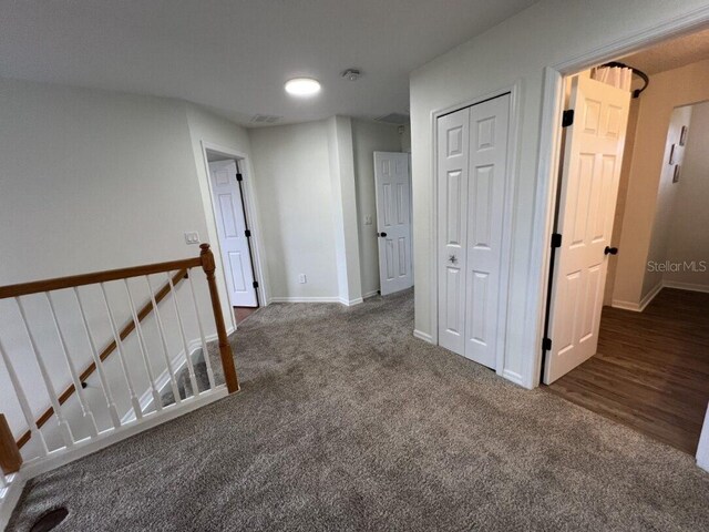 14936 Masthead Landing Cir, Winter Garden, FL 34787 - corridor with an upstairs landing, carpet floors, and baseboards