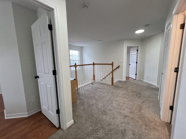 14936 Masthead Landing Cir, Winter Garden, FL 34787 - hallway with an upstairs landing, carpet floors, and baseboards