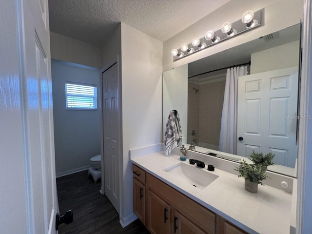 14936 Masthead Landing Cir, Winter Garden, FL 34787 - bathroom featuring toilet, vanity, wood finished floors, a shower with shower curtain, and baseboards