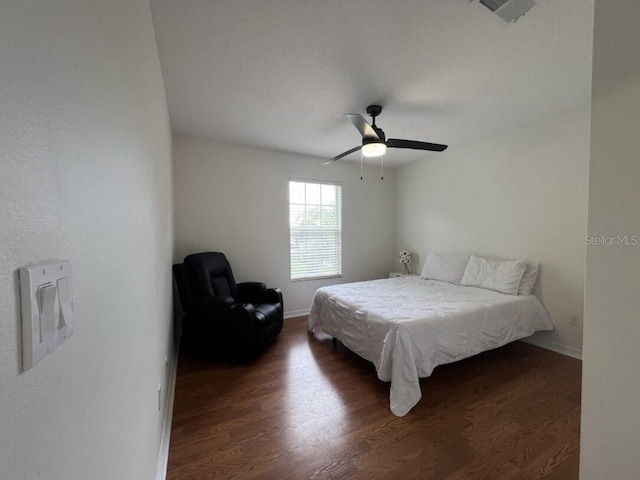 14936 Masthead Landing Cir, Winter Garden, FL 34787 - bedroom with dark wood-style floors, a ceiling fan, and baseboards