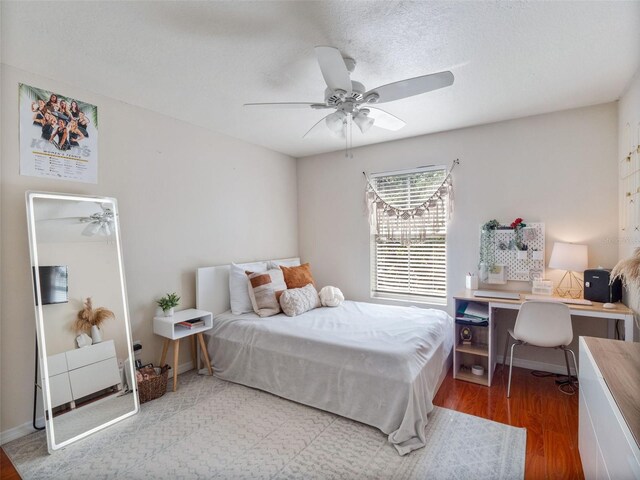 13156 Hatherton Cir, Orlando, FL 32832 - bedroom with wood finished floors, a desk, and ceiling fan