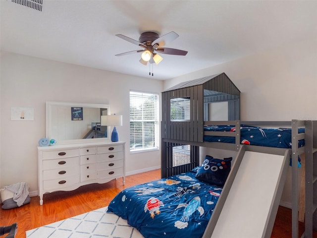 13156 Hatherton Cir, Orlando, FL 32832 - bedroom featuring wood finished floors, baseboards, and a ceiling fan
