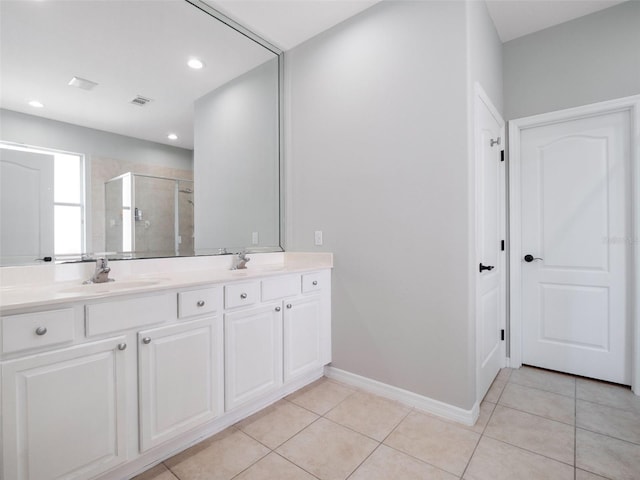 13156 Hatherton Cir, Orlando, FL 32832 - full bathroom with a stall shower, double vanity, tile patterned floors, recessed lighting, and baseboards