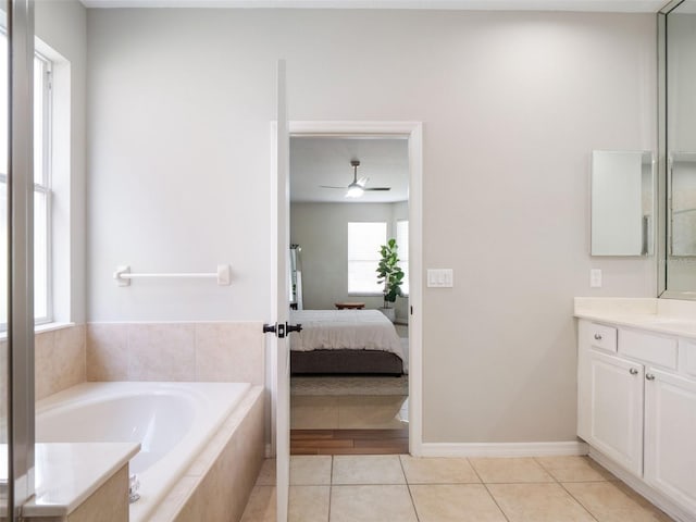 13156 Hatherton Cir, Orlando, FL 32832 - ensuite bathroom with vanity, a bath, healthy amount of natural light, and tile patterned floors