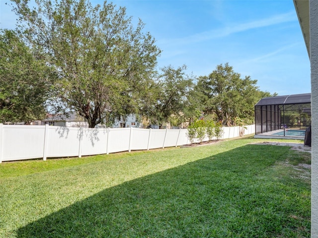 13156 Hatherton Cir, Orlando, FL 32832 - view of yard featuring glass enclosure and a detached carport