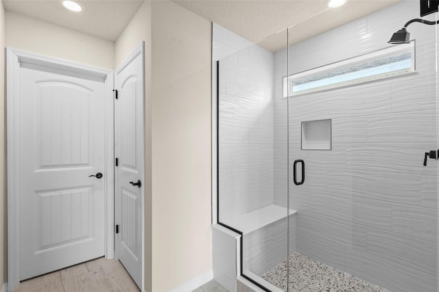 10245 Park Estates Ave, Orlando, FL 32836 - full bathroom featuring a stall shower, recessed lighting, and wood finished floors
