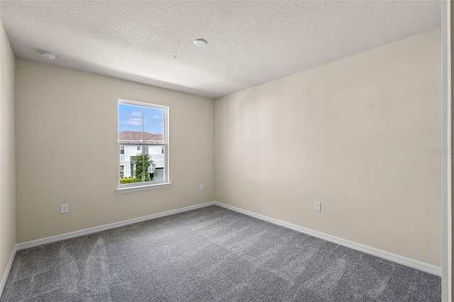 10245 Park Estates Ave, Orlando, FL 32836 - carpeted spare room featuring a textured ceiling and baseboards