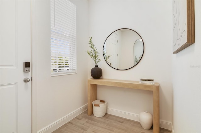 14655 Erice Ave, Clermont, FL 34714 - doorway to outside featuring light wood finished floors and baseboards