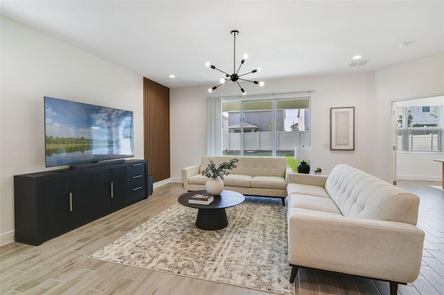 14655 Erice Ave, Clermont, FL 34714 - living room featuring a chandelier, light wood-style floors, recessed lighting, baseboards, and healthy amount of natural light