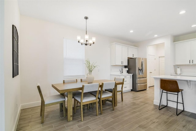 14655 Erice Ave, Clermont, FL 34714 - dining space featuring a chandelier, light wood finished floors, baseboards, and recessed lighting