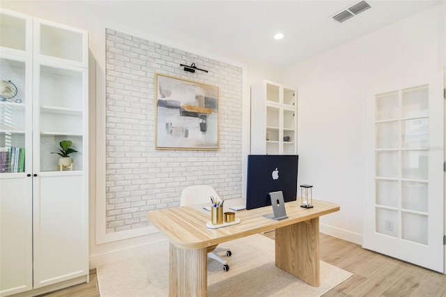 14655 Erice Ave, Clermont, FL 34714 - home office with light wood finished floors, baseboards, built in features, and recessed lighting