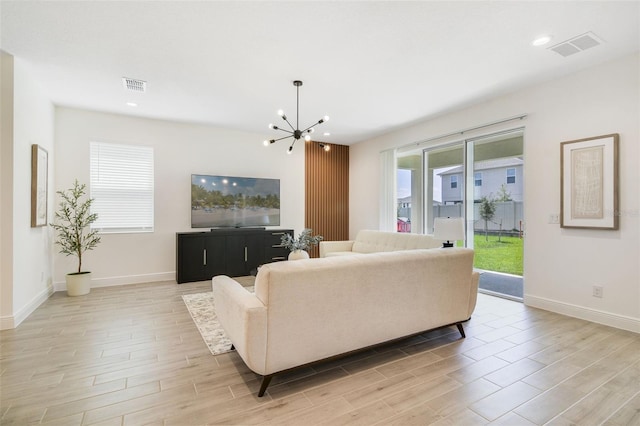 14655 Erice Ave, Clermont, FL 34714 - living area with light wood-style flooring, a chandelier, recessed lighting, and baseboards
