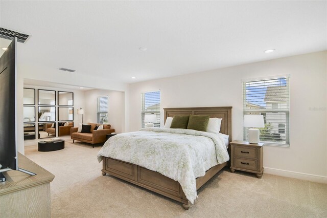 14655 Erice Ave, Clermont, FL 34714 - bedroom featuring light carpet, multiple windows, baseboards, and recessed lighting