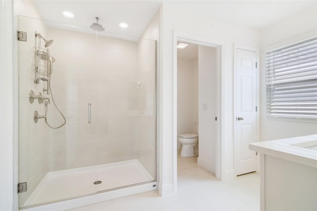 14655 Erice Ave, Clermont, FL 34714 - bathroom with a shower stall, toilet, tile patterned flooring, recessed lighting, and vanity