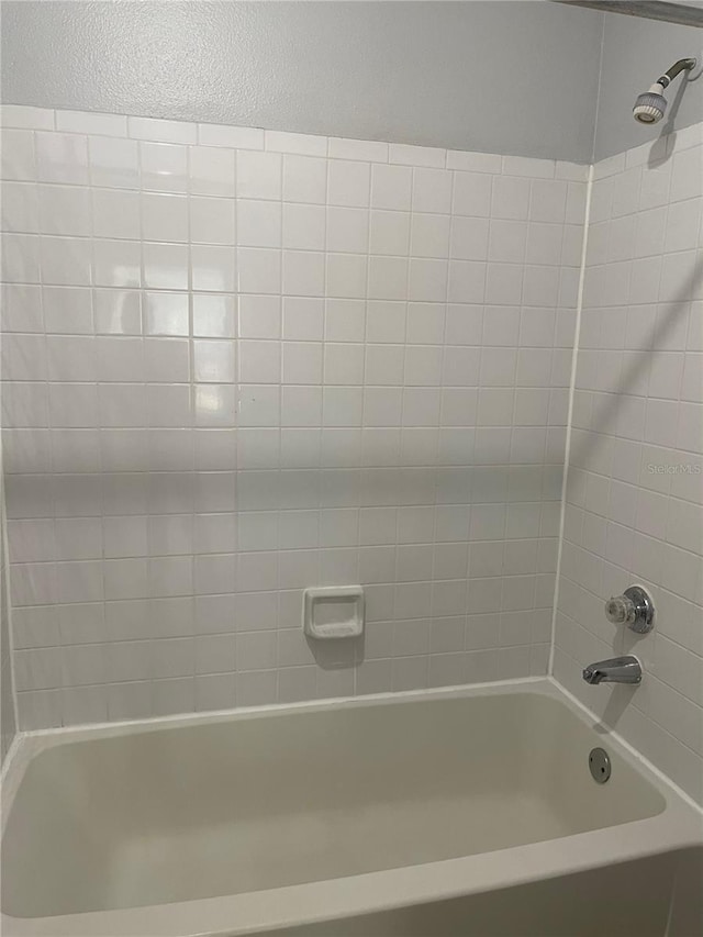 238 Afton Sq Unit 204, Altamonte Springs, FL 32714 - full bathroom featuring washtub / shower combination