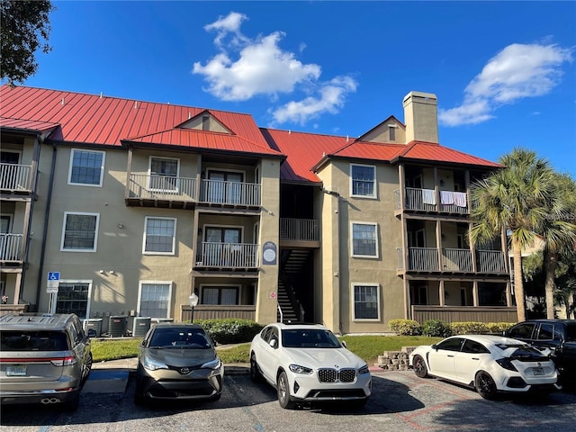 238 Afton Sq Unit 204, Altamonte Springs, FL 32714 - view of apartment building / complex with uncovered parking and cooling unit