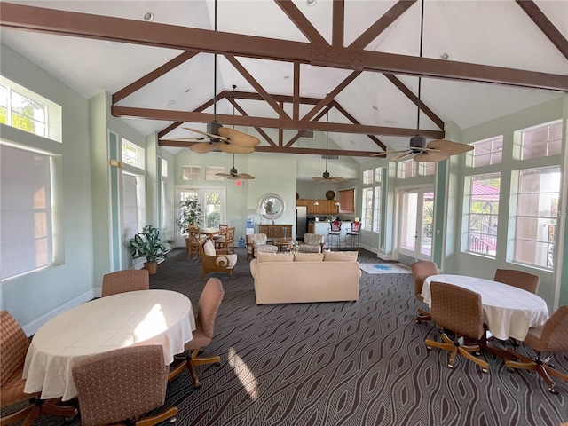 238 Afton Sq Unit 204, Altamonte Springs, FL 32714 - dining space with a ceiling fan, high vaulted ceiling, carpet, beamed ceiling, and baseboards