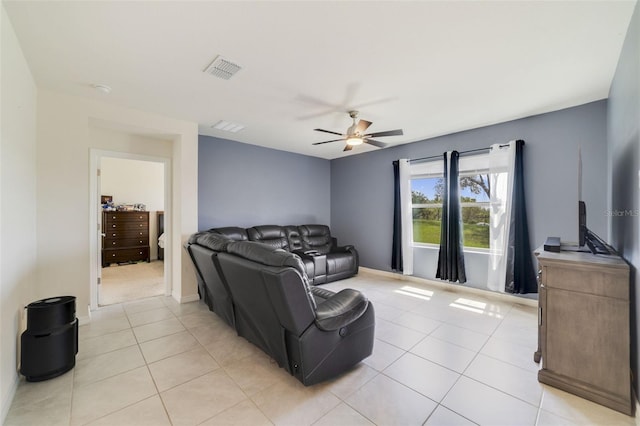 2135 E Old Mill Dr, Deltona, FL 32725 - living room with light tile patterned floors, a ceiling fan, and baseboards