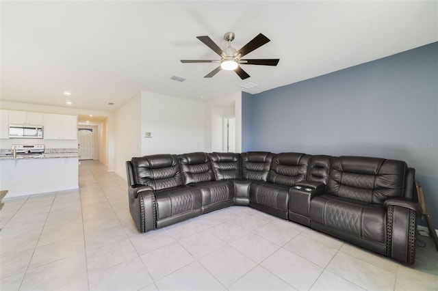 2135 E Old Mill Dr, Deltona, FL 32725 - living room featuring a ceiling fan and light tile patterned floors