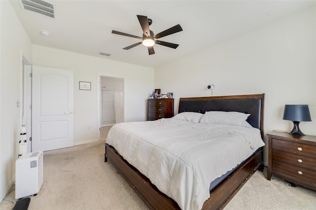 2135 E Old Mill Dr, Deltona, FL 32725 - bedroom with carpet, baseboards, a ceiling fan, and connected bathroom