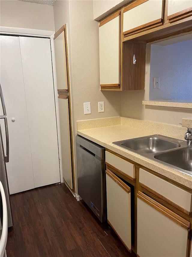 238 Afton Sq Unit 106, Altamonte Springs, FL 32714 - kitchen featuring stainless steel appliances, light countertops, dark wood-style floors, and a sink