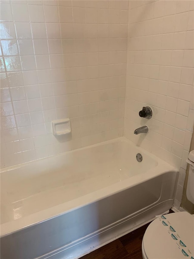238 Afton Sq Unit 106, Altamonte Springs, FL 32714 - full bathroom with toilet, bathtub / shower combination, and wood finished floors