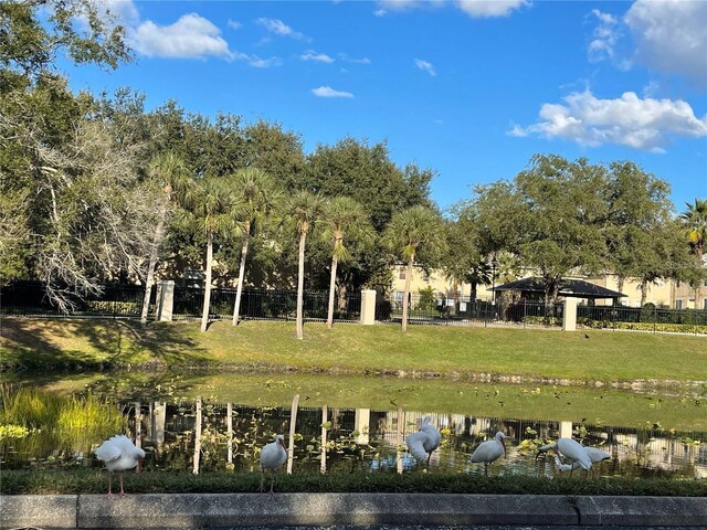 238 Afton Sq Unit 106, Altamonte Springs, FL 32714 - view of property's community with a water view and a lawn