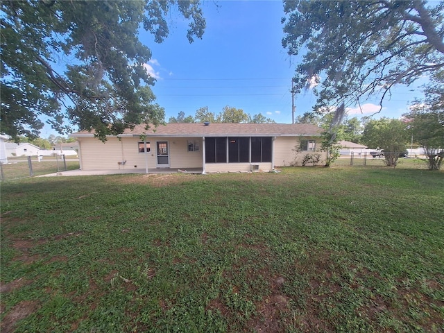 11282 SW 62nd Avenue Rd, Ocala, FL 34476 - rear view of property featuring a sunroom and a patio area