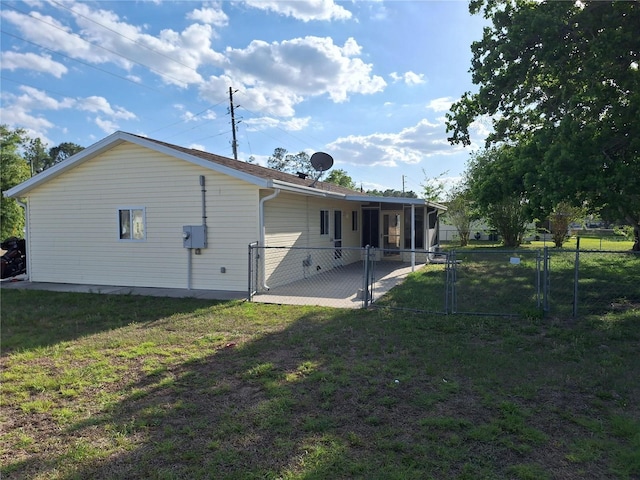 11282 SW 62nd Avenue Rd, Ocala, FL 34476 - back of house featuring a gate and a sunroom