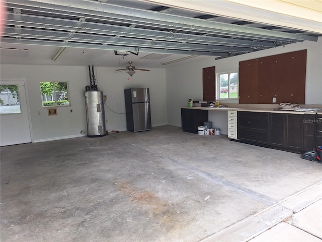 11282 SW 62nd Avenue Rd, Ocala, FL 34476 - garage featuring freestanding refrigerator, water heater, and a garage door opener