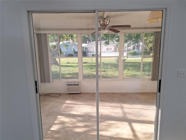 11282 SW 62nd Avenue Rd, Ocala, FL 34476 - unfurnished sunroom featuring an AC wall unit, a ceiling fan, and healthy amount of natural light